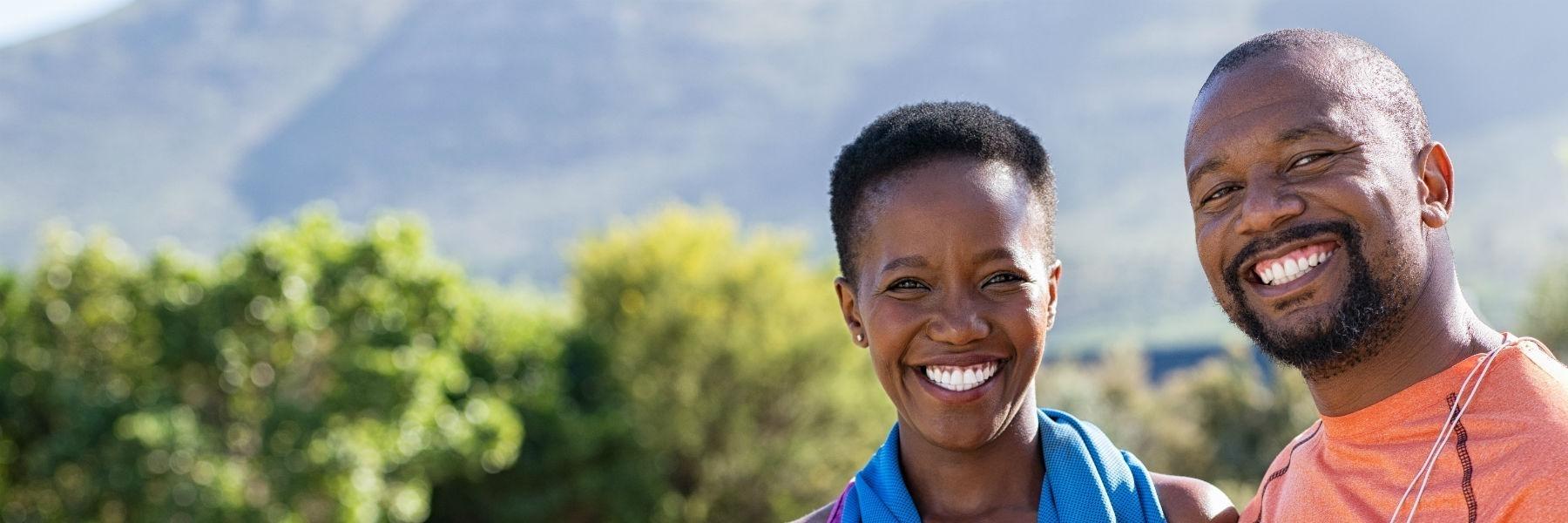 A black couple smiling after a restorative dentistry treatment in Temple, TX