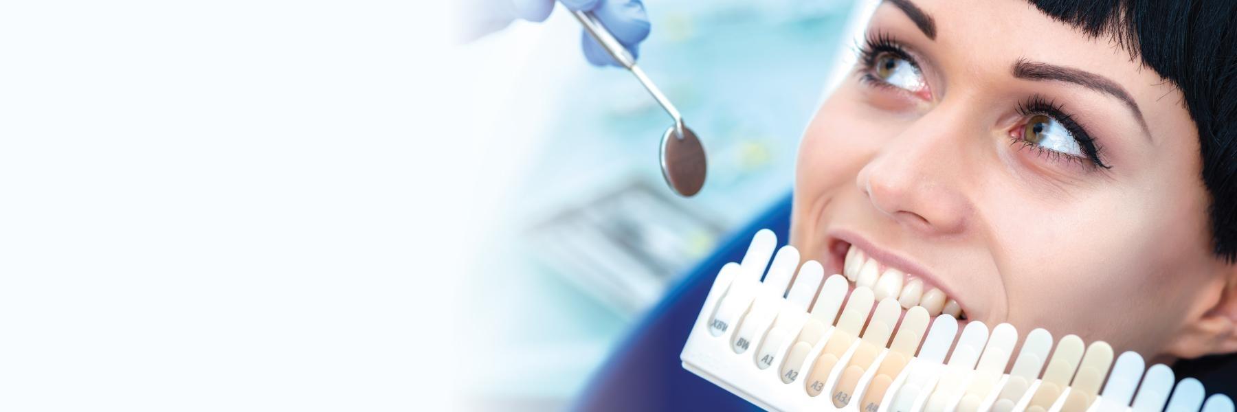 A woman being shown different teeth whitening options in Temple,TX